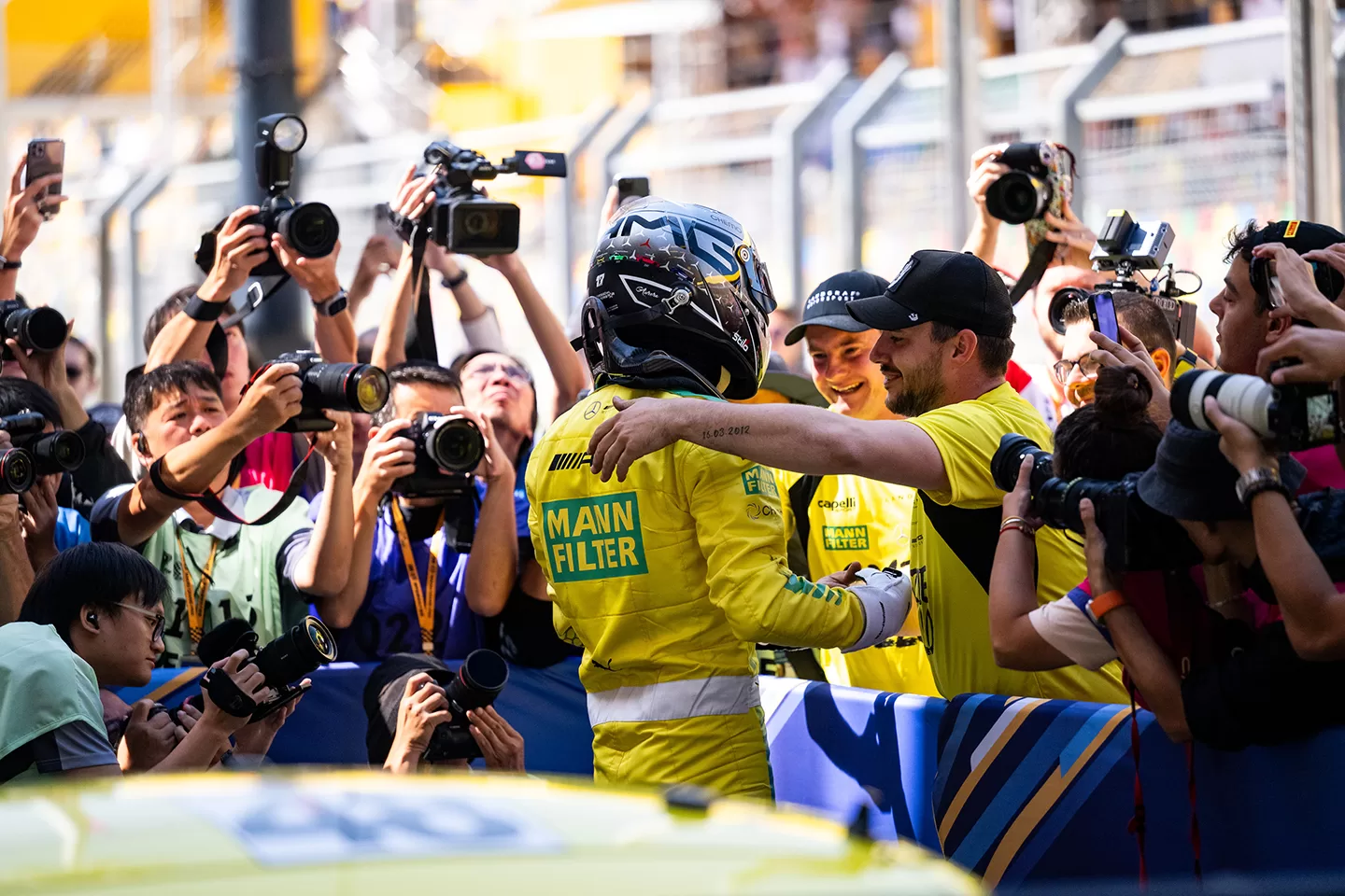 People cheering dressed in yellow