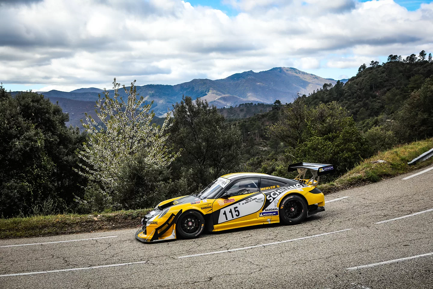 Yellow car racing in the mountains