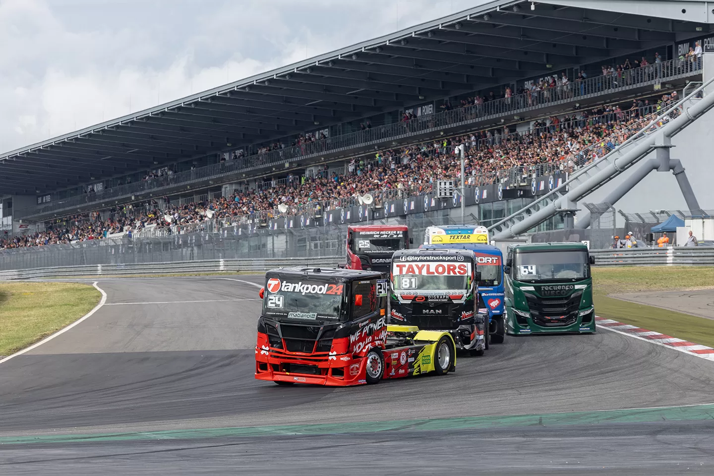 Group of trucks racing on a track