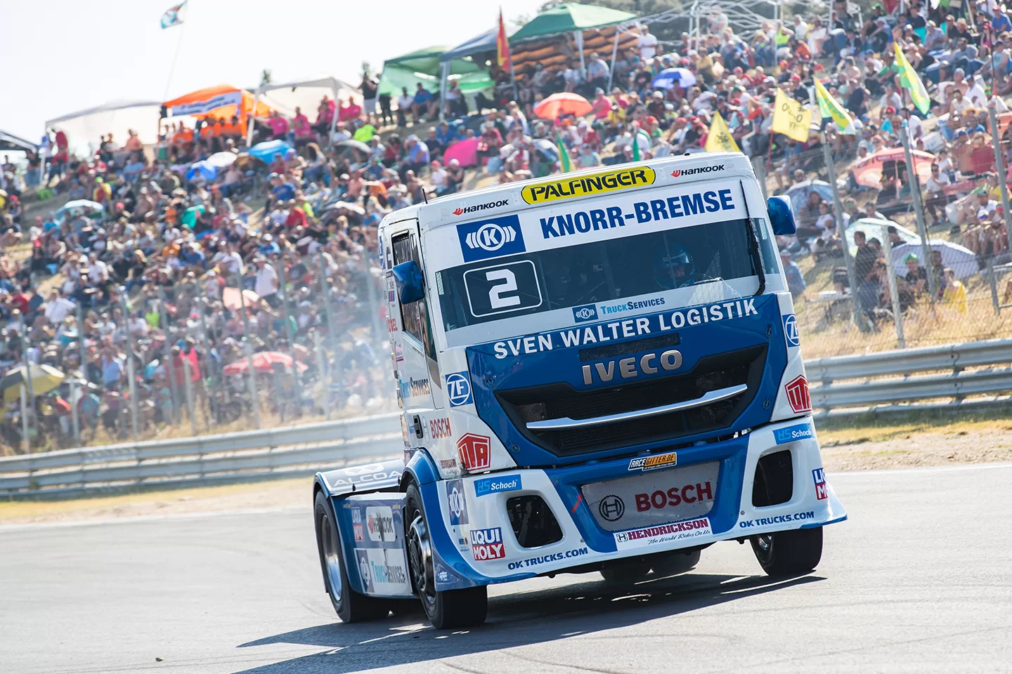 White and blue truck racing