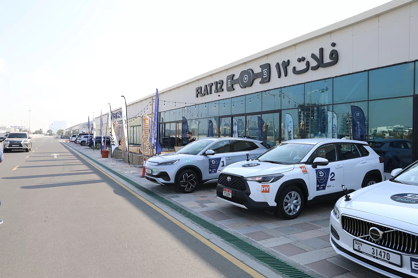 Cars parked outside of a glass window frontage