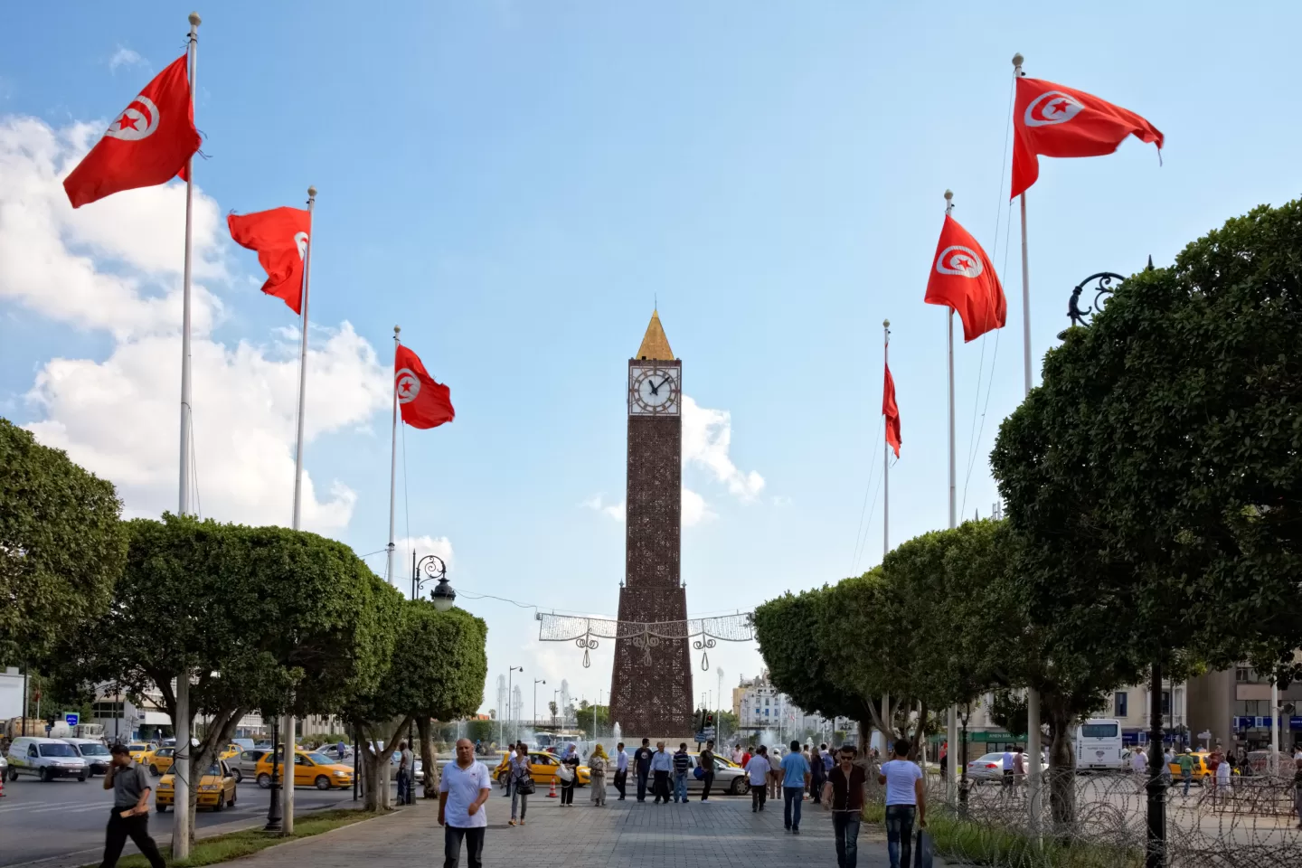 Clock tower with red flags