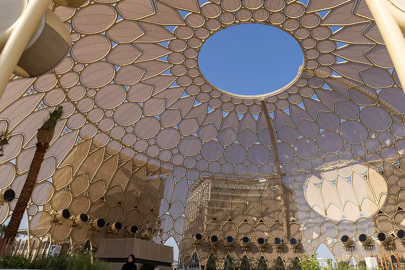 Inside a large building with a hole at the top