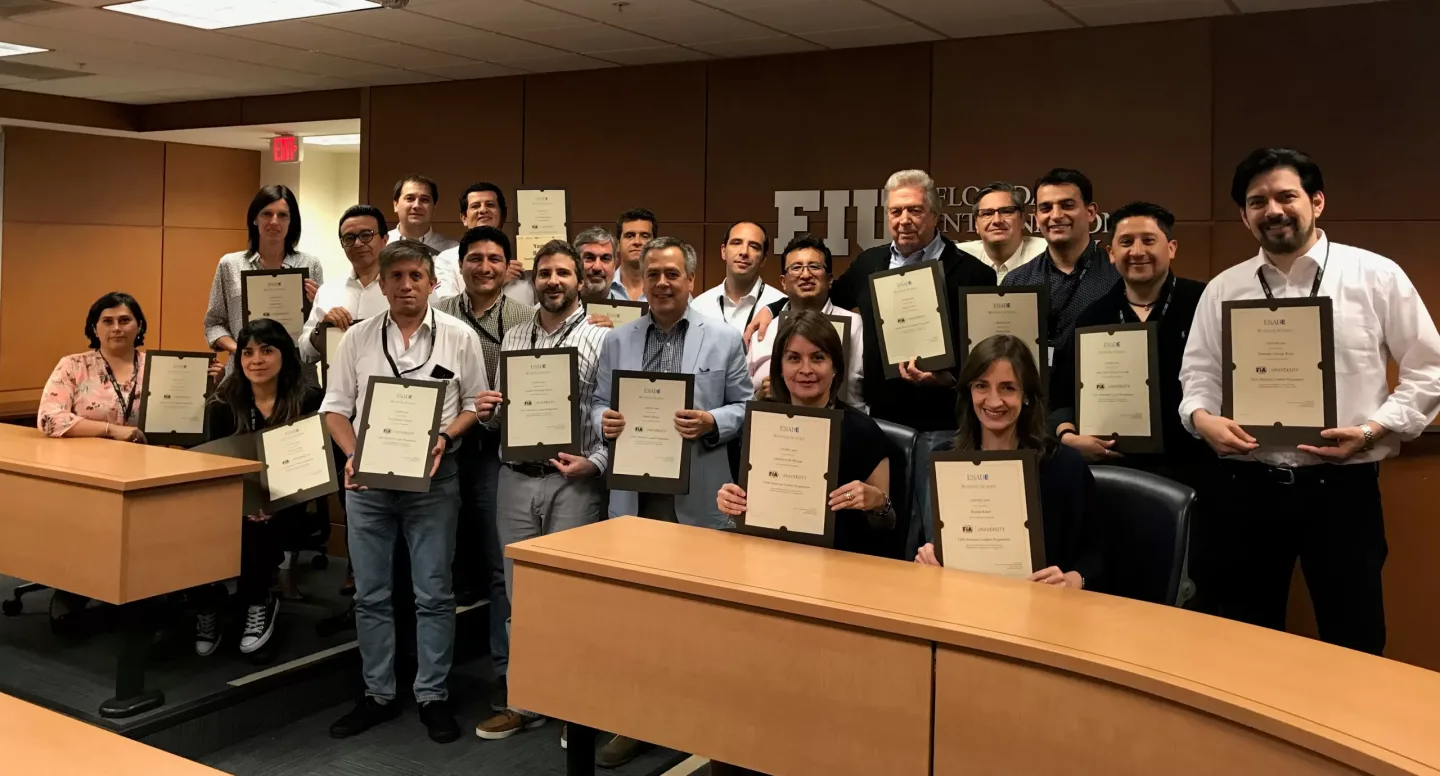 Group of people stood holding certificates in front of them