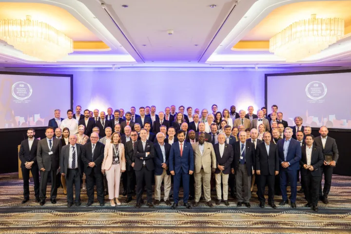 Group of people at a conference wearing suits