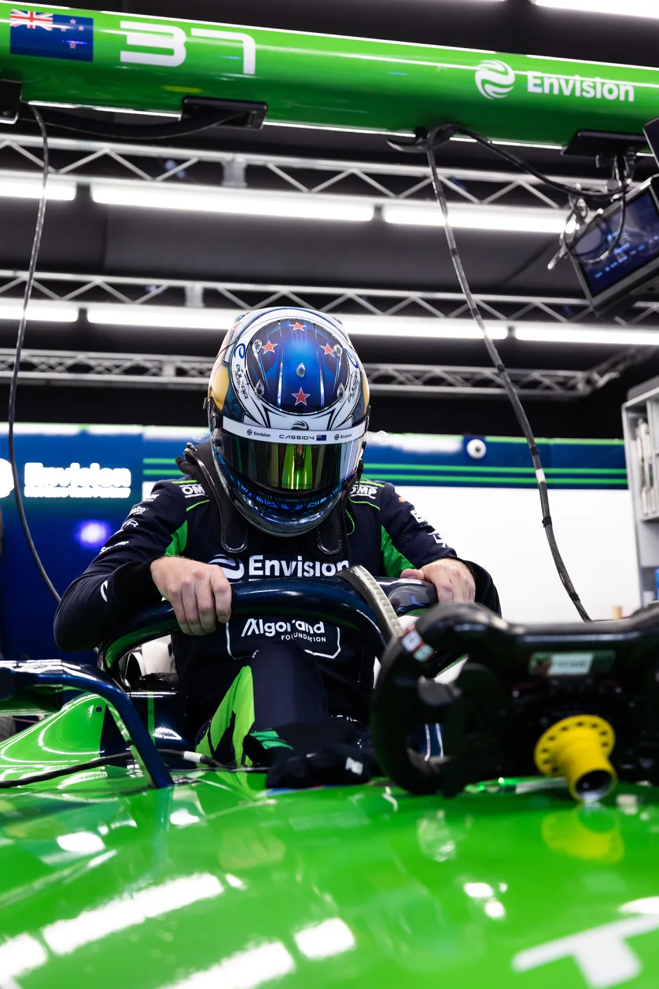 Green car framing a driver