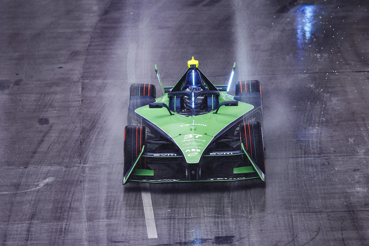 Green racing car on track